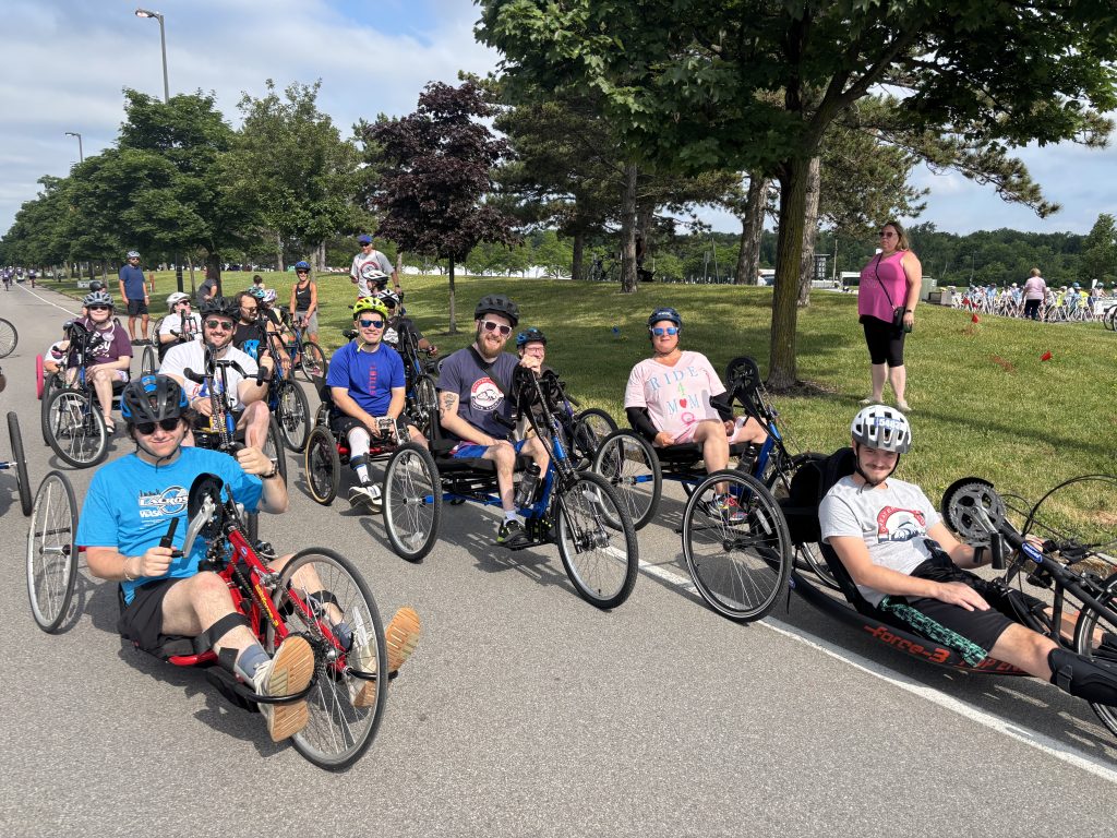 A group of athletes in handcycles